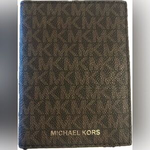 Michael Kors Brown Monogram Wallet with card slots. Excellent condition.